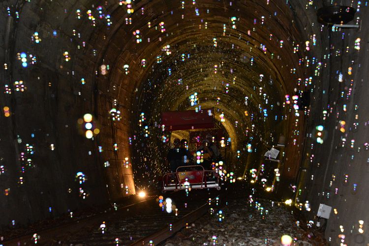 Themed tunnel lights and colorful decorations rail bike